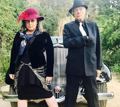 Dick Van Dyke recreating pose of Bonnie and Clyde with his wife.